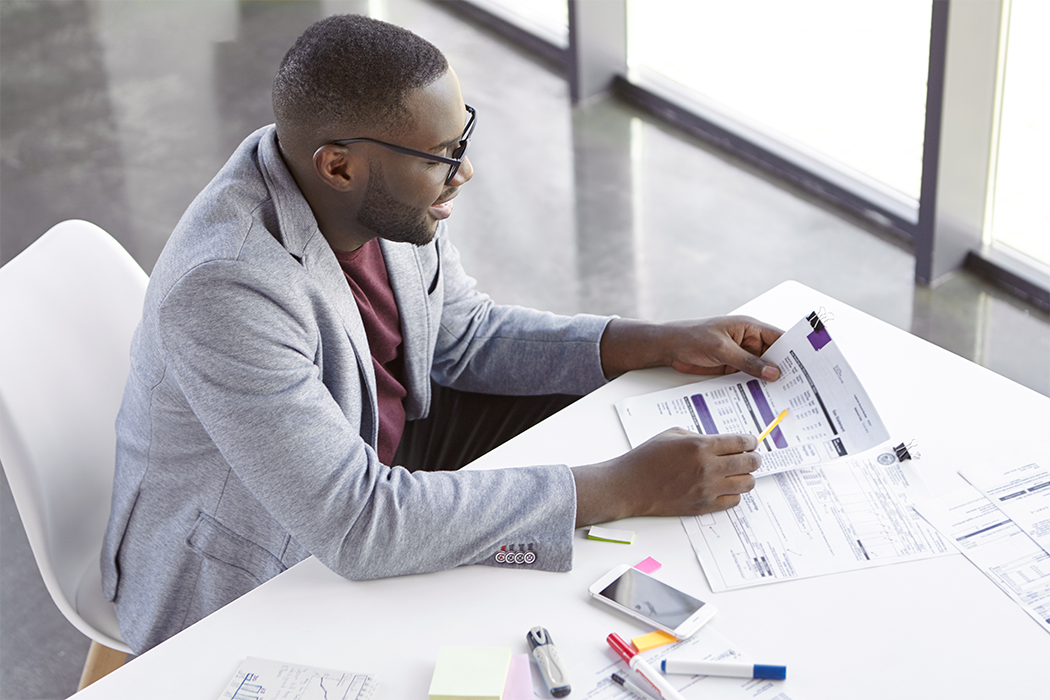 elegant-young-man-working-office
